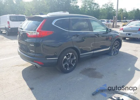 2018 Honda Cr-V Touring z USA, uszkodzony, nr VIN 7FARW2H93JE047695